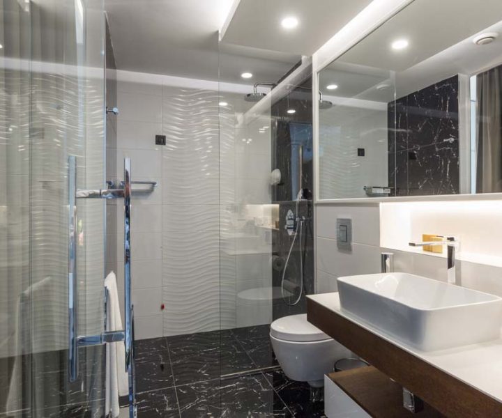 Interior of a luxury bathroom with glass shower cabin