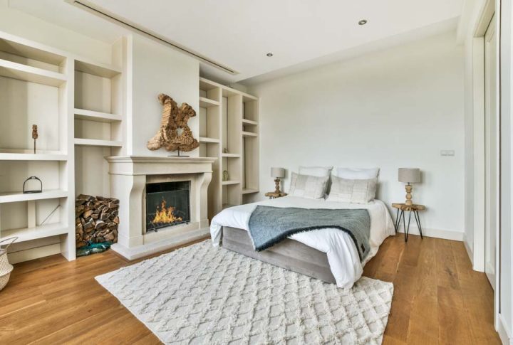 a master bedroom suite with a soft bed and a carpet