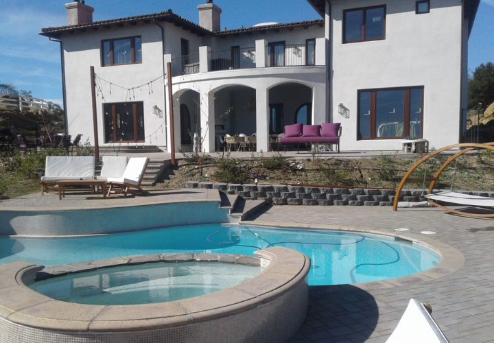 a beautiful patio of a villa with swimming pool and jacuzzi